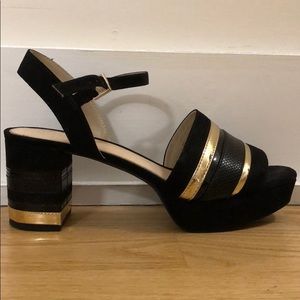 Black and gold platform heels